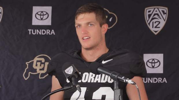 Trevor Woods at the Podium at CU